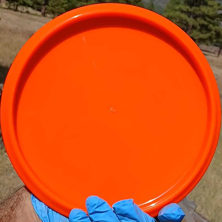 77020310.05 Gold Ice Compass orange disc golf midrange from Dynamic Discs. back view.