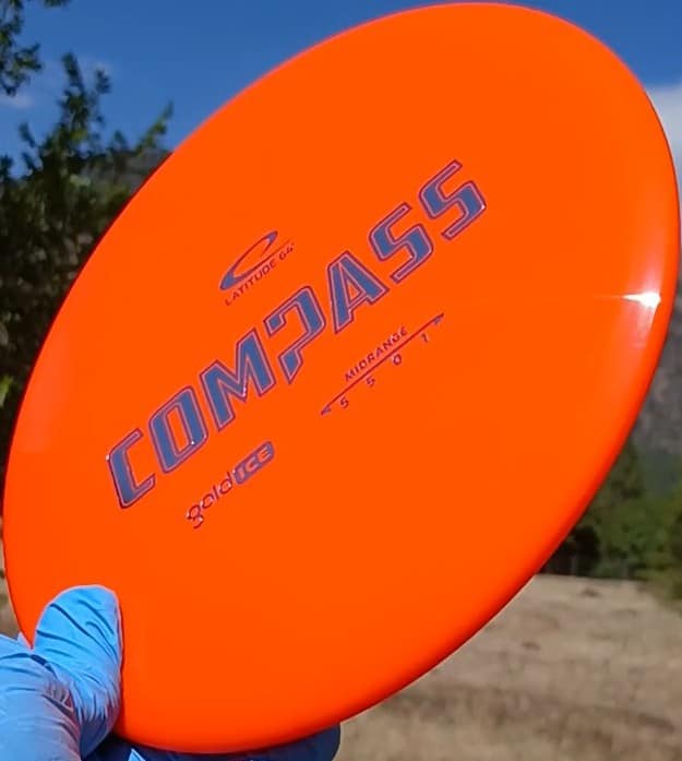 77020310.05 Gold Ice Compass orange disc golf midrange from Dynamic Discs.