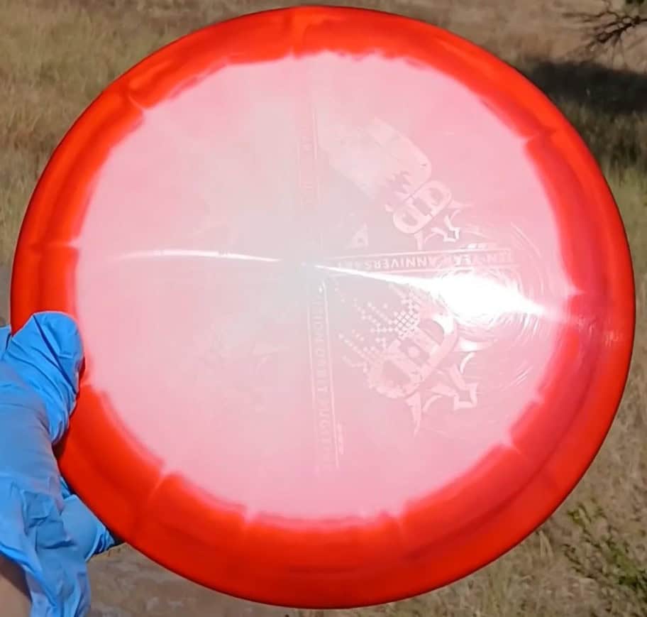 88010301.01 Fuzion Fugitive Orbit Red Blank disc golf midrange Special Edition from Dynamic Discs. ghost reflection on hot stamp