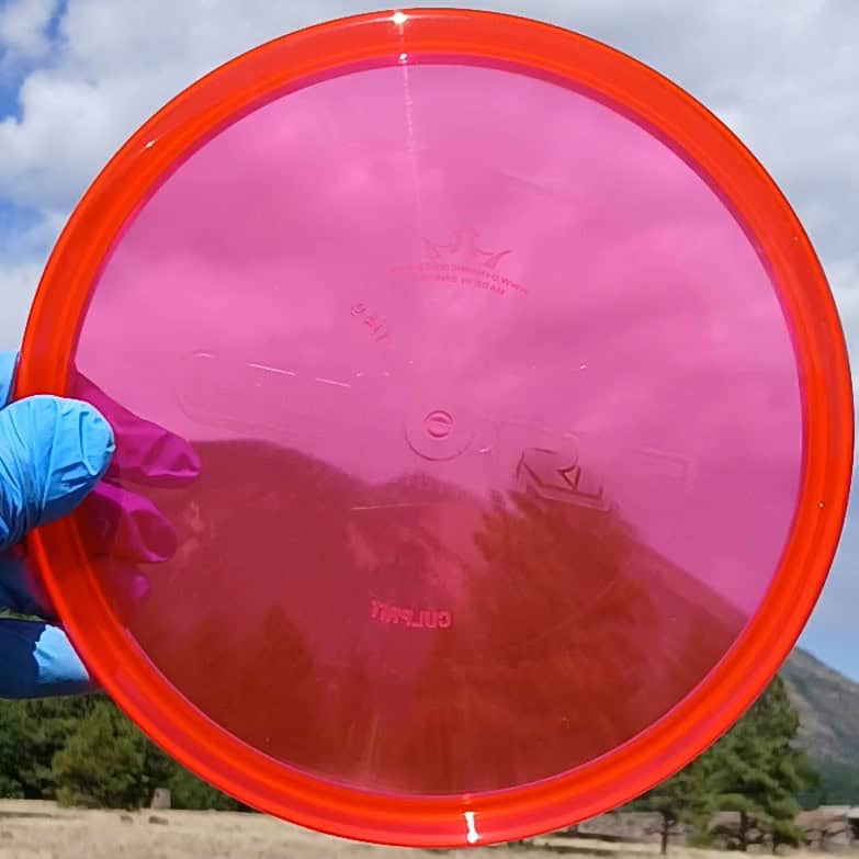 88011210.01 Lucid Ice Culprit Red Wiped Proto overstable disc golf midrange/putter hybrid from Dynamic Discs. ghost stamp wiped disc front view