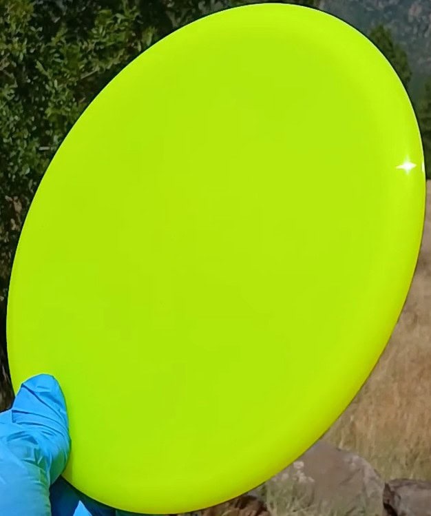 88011210.02 Lucid-X Chris Clemons Culprit yellow overstable midrange from Dynamic Discs. Special Edition wiped ghost stamp. front tilt view