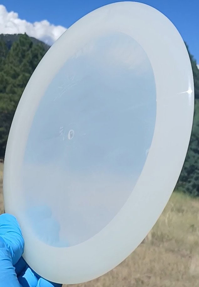 88014210.03 Lucid Ice Defender white blank overstable disc golf distance driver from Dynamic Discs. front tilt view
