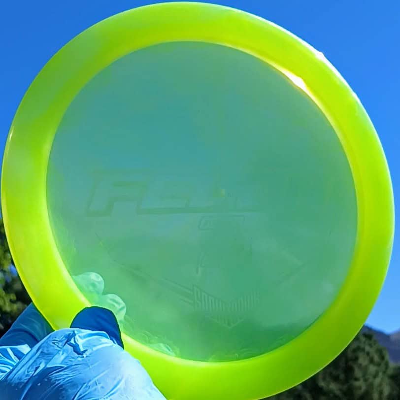 Lucid Sparkle Felon Yellow Wiped Fairway Driver 173g from Dynamic Discs. front skyline view ghost stamp