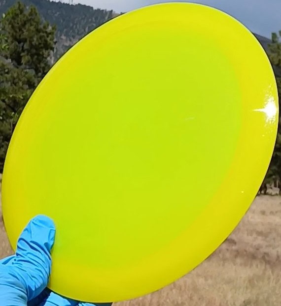 88037703.02 VIP Air Northman yellow blank disc golf lightweight distance driver from Westside Discs. front tilt view