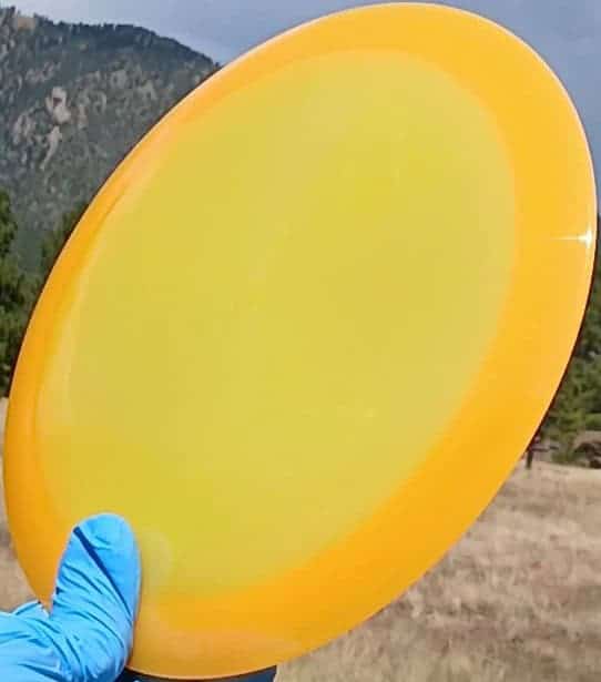 88037703.05 VIP Air Northman orange blank lightweight disc golf distance driver from Westside Discs. front tilt view
