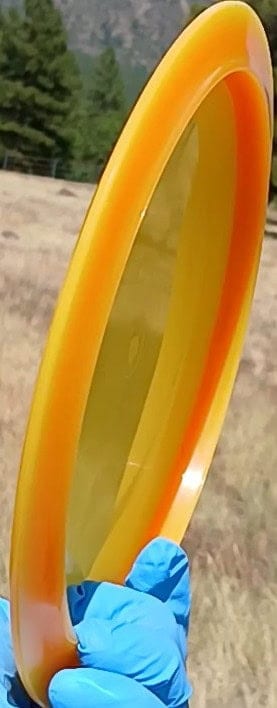 88037703.05 VIP Air Northman orange blank lightweight disc golf distance driver from Westside Discs. profile wing view