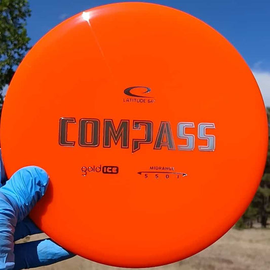 77020310.05 Gold Ice Compass orange disc golf midrange from Dynamic Discs. front view.