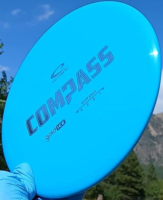 77020310.08 Gold Ice Compass aqua disc golf midrange from Dynamic Discs. front view tilt