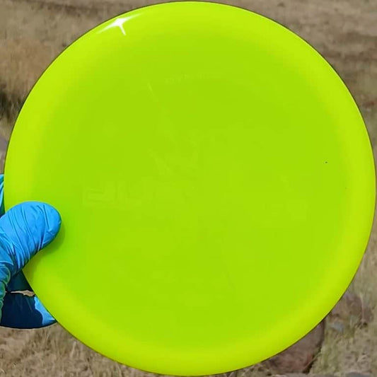 8801402.02 Lucid Justice yellow disc golf overstable midrange from Dynamic Discs. Wiped ghost stamp front view