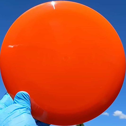88024001.01 Gold Line Ballista orange wiped disc golf distance driver from Latitude 64. front sky view
