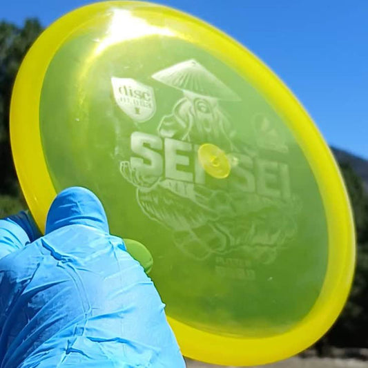 88042501.11 Active Premium Sensei yellow wiped disc golf putter from Discmania. front view