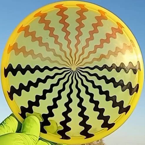 Active premium Maestro discmania Dizzy geometric disc golf stencil dye red and black on yellow disc.