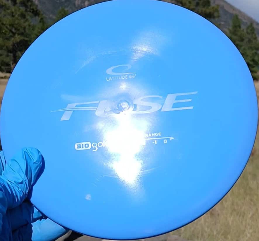 Latitude 64 BioGold Fuse Blue Wiped midrange front angled view ghost stamp reflection