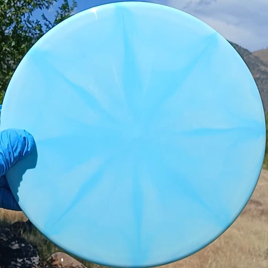 Dynamic Discs Fuzion Justice blue burst blank midrange front view