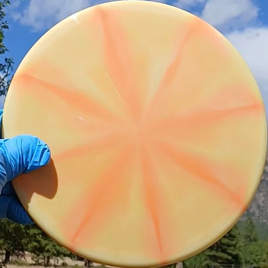 Dynamic Discs Fuzion Justice orange burst blank midrange front view