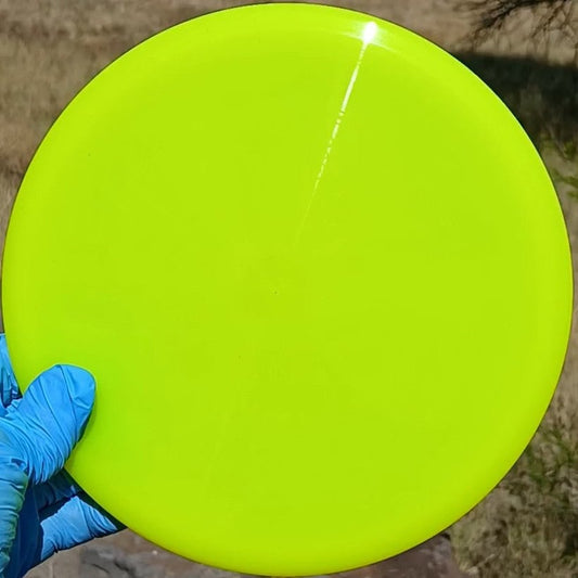 Lucid-X Chris Clemons Culprit yellow overstable midrange from Dynamic Discs. Special Edition wiped ghost stamp front view