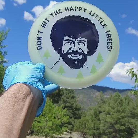 044703.06 Glow Majesty Bob Ross custom disc golf design on glow-in-th-dark Discmania Majesty.