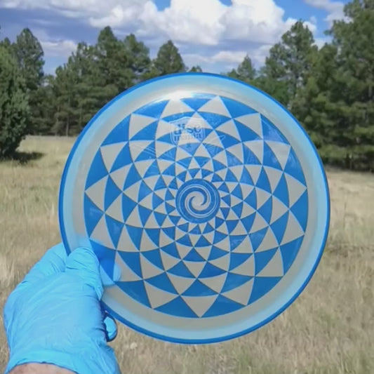 042603.18 Shogun Glow Penny Flower disc golf putter from Discmania. Pink geometric disc golf design.