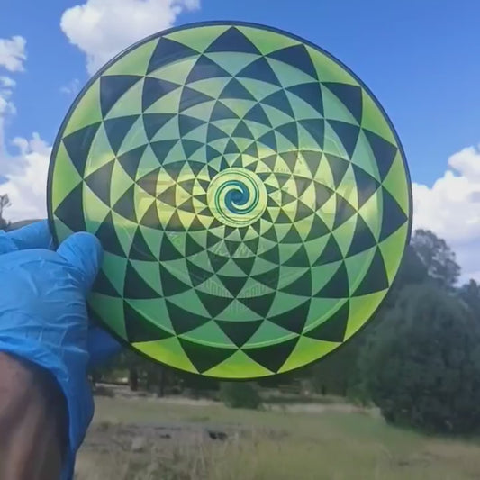 017402.06 Lucid Sparkle Felon Penny Flower geometric disc golf design on yellow Ricky Wysocki SOCKIBOMB overstable fairway driver from Dynamic Discs.