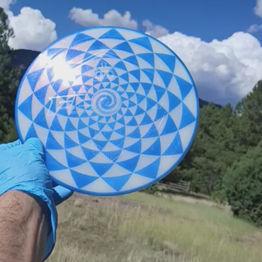 017402.03 Lucid Sparkle Felon Penny Flower blue geometric disc golf design on white Ricky Wysocki SOCKIBOMB overstable fairway driver from Dynamic Discs.