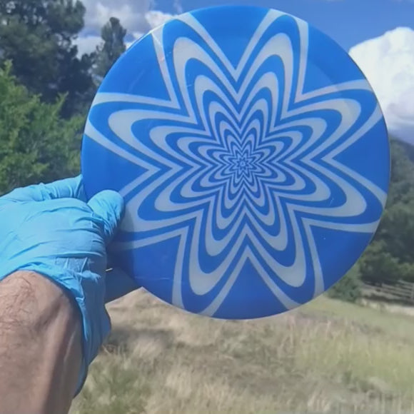 017402.05 Lucid Sparkle Ultimate Dizziness blue floral geometric disc golf design on white Ricky Wysocki SOCKIBOMB metallic flake Felon from Dynamic Discs.