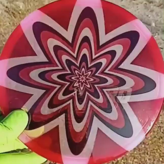040102.04 Maestro Ultimate Dizziness disc golf midrange with custom geometric design. Pink disc with black and red flowers.