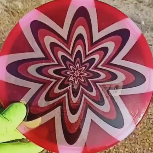 040102.04 Maestro Ultimate Dizziness disc golf midrange with custom geometric design. Pink disc with black and red flowers.