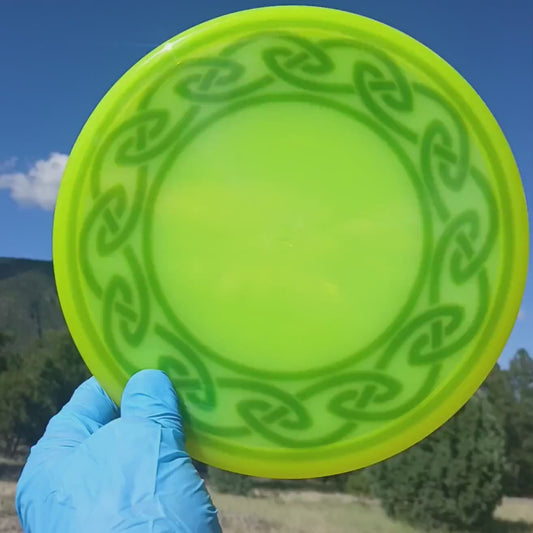 010710.07. Lucid Ice Suspect Celtic Circle custom disc golf design on bright yellow Lucid Ice Suspect disc golf putter from Dynamic Discs.